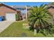 Exterior view of townhouse with manicured lawn, shrubbery, and an outdoor utility box at 17 Lawn St, Oviedo, FL 32765
