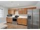 Well-equipped kitchen boasting stainless steel appliances, stylish wooden cabinetry, and plenty of storage at 17 Lawn St, Oviedo, FL 32765
