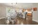 Open-concept kitchen with stainless appliances, a breakfast bar, and adjacent dining area at 17 Lawn St, Oviedo, FL 32765
