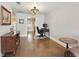 Office space with desk setup, stylish lighting, and views into the hall and kitchen at 17 Lawn St, Oviedo, FL 32765