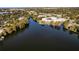 Scenic aerial view of contemporary townhomes with private lake access and lush surroundings at 1816 Mondrian Cir, Winter Park, FL 32789