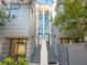 Contemporary townhome showcasing a gray exterior, ascending stairs, and a welcoming entrance at 1816 Mondrian Cir, Winter Park, FL 32789