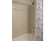Shower and tub area features beige tiling with a floral design at 1935 Conway Rd # R5, Orlando, FL 32812