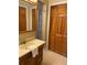 Bathroom featuring a standard vanity, light countertop, with wood cabinets and a towel at 1935 Conway Rd # R5, Orlando, FL 32812