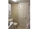 Small bathroom showing a toilet, stacked washer/dryer, shower with curtain, and neutral tones at 1935 Conway Rd # R5, Orlando, FL 32812