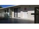 Exterior view featuring a front door with a decorative wreath and a small patio space with seating at 1935 Conway Rd # R5, Orlando, FL 32812
