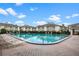 Community pool featuring lounge chairs and a shade structure at 1935 Conway Rd # R5, Orlando, FL 32812