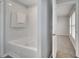 Bathroom featuring a white tub and a view into the bedroom at 2026 Cypress Bay Blvd, Kissimmee, FL 34743