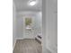 Inviting entryway featuring wood-look floors, a staircase, and a glass-paned door at 2026 Cypress Bay Blvd, Kissimmee, FL 34743