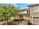 Charming townhouse with a brick-paved driveway and lush landscaping at 2026 Cypress Bay Blvd, Kissimmee, FL 34743