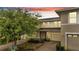 Charming two-story townhome with well-maintained landscaping and a private garage at 2026 Cypress Bay Blvd, Kissimmee, FL 34743