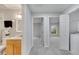 Bright hallway with a bathroom on the left and bedroom and laundry ahead at 2026 Cypress Bay Blvd, Kissimmee, FL 34743