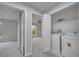 Bright laundry area featuring a washer, dryer, and ample closet space for convenient home care at 2026 Cypress Bay Blvd, Kissimmee, FL 34743