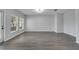 Open living room featuring wood-look floors, neutral paint, and natural light at 2026 Cypress Bay Blvd, Kissimmee, FL 34743