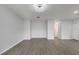 Expansive living room with gray vinyl flooring and neutral paint, offering versatile design at 2026 Cypress Bay Blvd, Kissimmee, FL 34743
