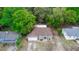 Charming single-Gathering home featuring a well-manicured lawn, mature trees, and a welcoming facade at 216 Clara Vista St, Debary, FL 32713