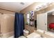 Cozy bathroom featuring a shower/tub combination and framed decorative art at 216 Clara Vista St, Debary, FL 32713
