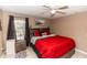 Inviting bedroom with a ceiling fan, neutral walls, stylish decor, and a comfortable bed at 216 Clara Vista St, Debary, FL 32713