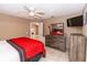 Comfortable bedroom featuring a ceiling fan, neutral walls, stylish decor, and a cozy bed at 216 Clara Vista St, Debary, FL 32713