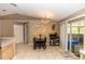 Cozy dining area adjacent to the kitchen with a chandelier, table, and chairs, perfect for Gathering meals at 216 Clara Vista St, Debary, FL 32713