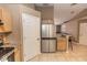 Modern kitchen with stainless steel appliances, ample cabinet space, and a view of the adjacent living area at 216 Clara Vista St, Debary, FL 32713