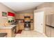 Well-lit kitchen featuring ample counter space, stainless steel appliances, and classic wooden cabinetry at 216 Clara Vista St, Debary, FL 32713