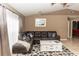 Comfortable living room featuring a sectional sofa, a stylish coffee table, and large windows with natural lighting at 216 Clara Vista St, Debary, FL 32713
