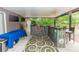 Covered patio with an outdoor bar, TV, and seating for entertaining at 216 Clara Vista St, Debary, FL 32713