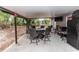 Covered patio featuring an outdoor dining area with a fire pit and TV at 216 Clara Vista St, Debary, FL 32713