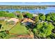 Aerial view showcasing the property's expansive yard with a beautiful lake view at 2230 Lake Crescent Ct, Windermere, FL 34786