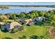Aerial view of the property showcasing its large lot, screened-in pool, and proximity to a beautiful lake at 2230 Lake Crescent Ct, Windermere, FL 34786