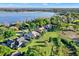 A beautiful aerial view of homes near a lake at 2230 Lake Crescent Ct, Windermere, FL 34786