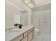Bathroom featuring double sinks, tile flooring, and a glass-enclosed shower at 2230 Lake Crescent Ct, Windermere, FL 34786