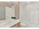 Bathroom with a shower and bathtub, vanity and wallpaper at 2230 Lake Crescent Ct, Windermere, FL 34786