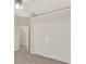 Bedroom with a large closet, ceiling fan and neutral carpeted floors at 2230 Lake Crescent Ct, Windermere, FL 34786