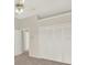 Bedroom with a large closet, ceiling fan and neutral carpeted floors at 2230 Lake Crescent Ct, Windermere, FL 34786