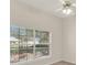 Bedroom with neutral walls, ceiling fan, and a window view to backyard at 2230 Lake Crescent Ct, Windermere, FL 34786
