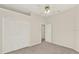 Bedroom with a large closet, ceiling fan and neutral carpeted floors at 2230 Lake Crescent Ct, Windermere, FL 34786