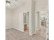 Spacious bedroom with neutral walls and carpet, multiple doorways, and an ensuite bathroom at 2230 Lake Crescent Ct, Windermere, FL 34786