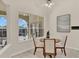 Bright dining area features large windows and a round table with seating for four at 2230 Lake Crescent Ct, Windermere, FL 34786