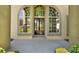Elegant front entrance featuring tall windows, a solid door, and manicured landscaping at 2230 Lake Crescent Ct, Windermere, FL 34786