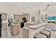 Well-lit kitchen featuring a wraparound counter, center island, and black appliances at 2230 Lake Crescent Ct, Windermere, FL 34786