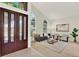 Inviting living room with large windows, modern furniture, and a welcoming ambiance at 2230 Lake Crescent Ct, Windermere, FL 34786