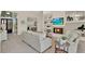 Bright living room with fireplace, built in shelving, and large windows that flood the home with natural light at 2230 Lake Crescent Ct, Windermere, FL 34786