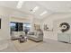 Spacious living room with vaulted ceilings, skylights, and sliding glass doors to outdoor living space at 2230 Lake Crescent Ct, Windermere, FL 34786