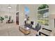 Comfortable living area with large windows, stylish furnishings, and an open floor plan at 2230 Lake Crescent Ct, Windermere, FL 34786
