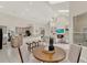 Open-concept living space showcases a modern kitchen, cozy living room with fireplace, and dining area at 2230 Lake Crescent Ct, Windermere, FL 34786