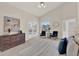 Spacious main bedroom features a ceiling fan, two chairs, and an ensuite bathroom at 2230 Lake Crescent Ct, Windermere, FL 34786