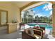 Screened in pool features outdoor bar and seating at 2230 Lake Crescent Ct, Windermere, FL 34786
