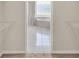 Walk-in closet that opens to bathroom featuring garden tub at 2230 Lake Crescent Ct, Windermere, FL 34786